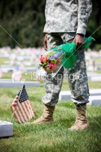 army grave with flag and flowrds istock photo